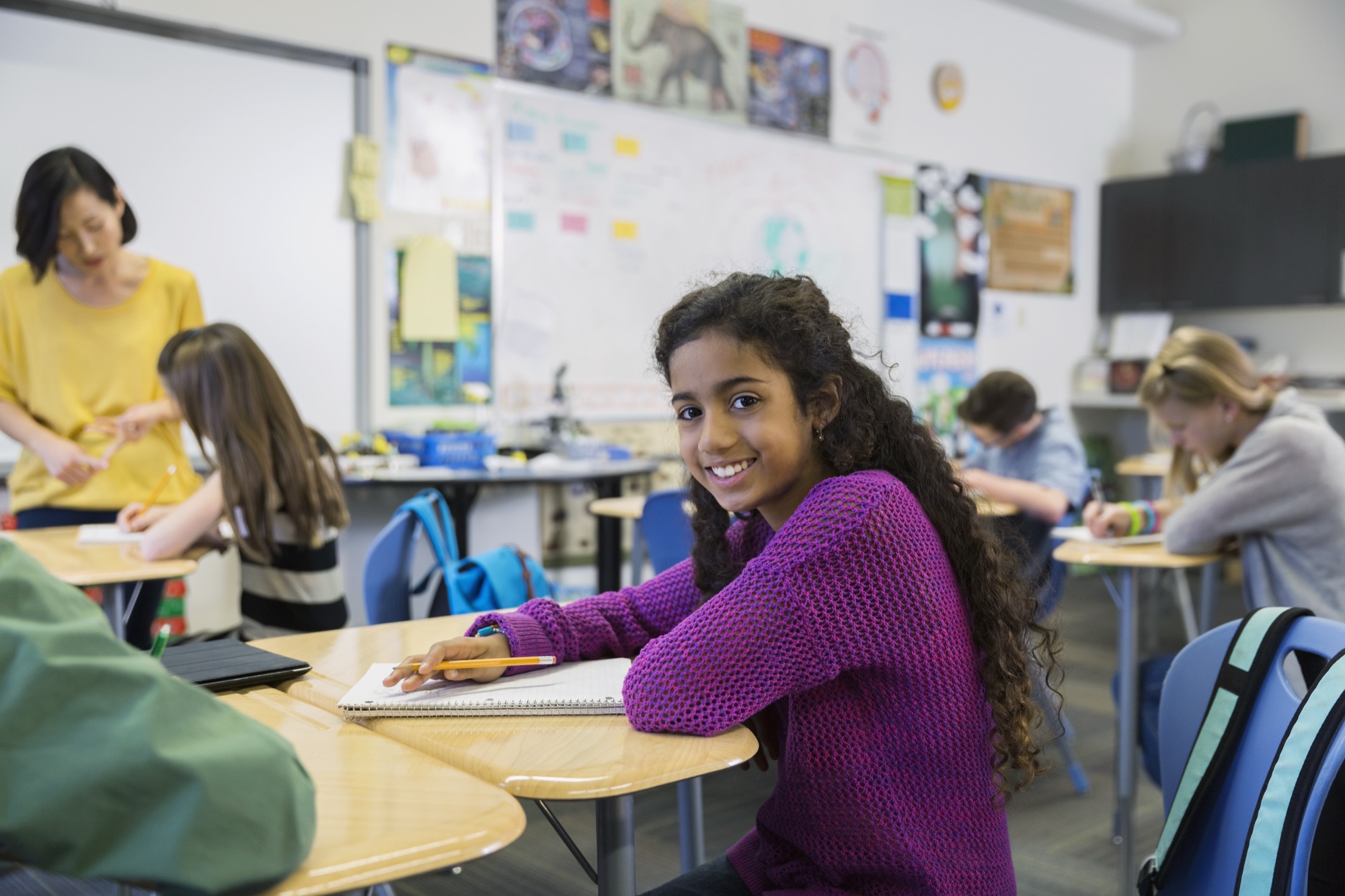 A confident student smiling in the classroom